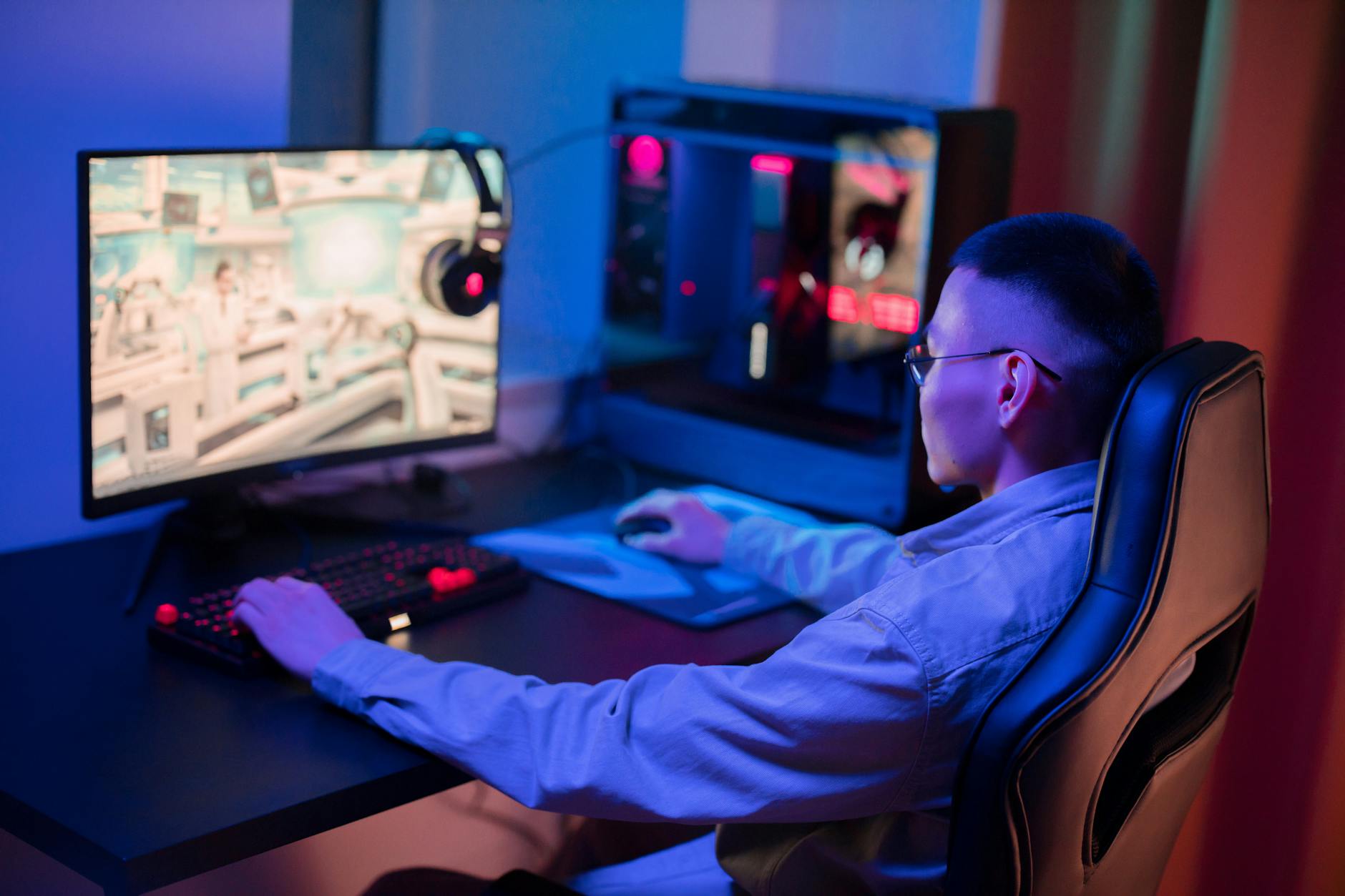 a man using a computer with the blue light blocking glass.